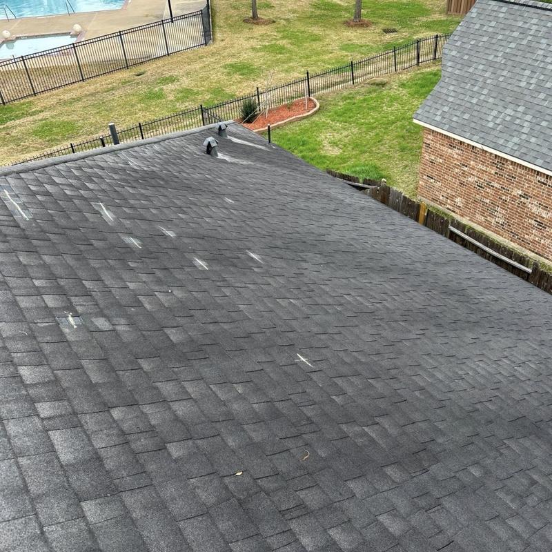 Asphalt shingle roof with wind damage inspection