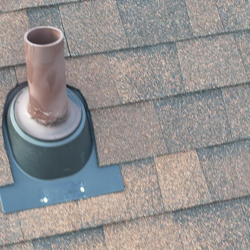 Roof pipe flashing on shingle roof installation