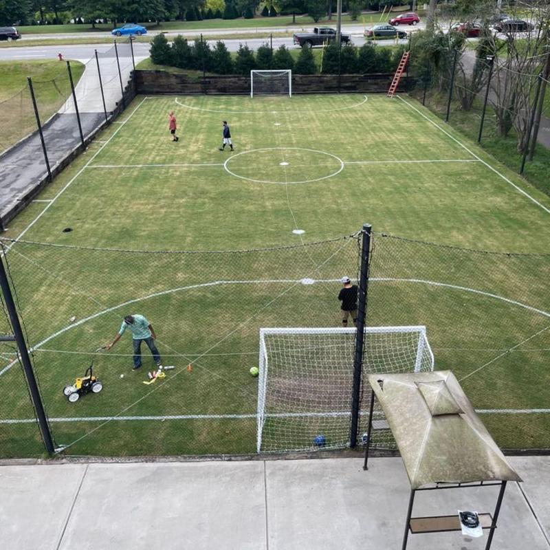 Soccer field turf installation with goal nets Soccer field turf installation with goal nets