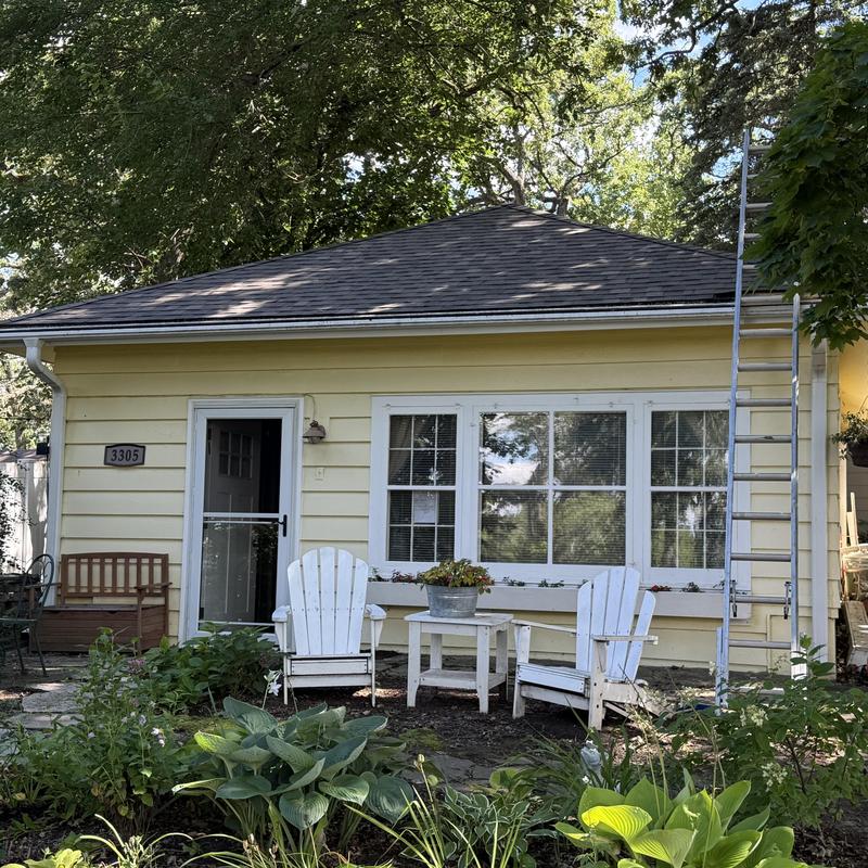 Atlas Impact Class 4 shingle roof with ladder on house