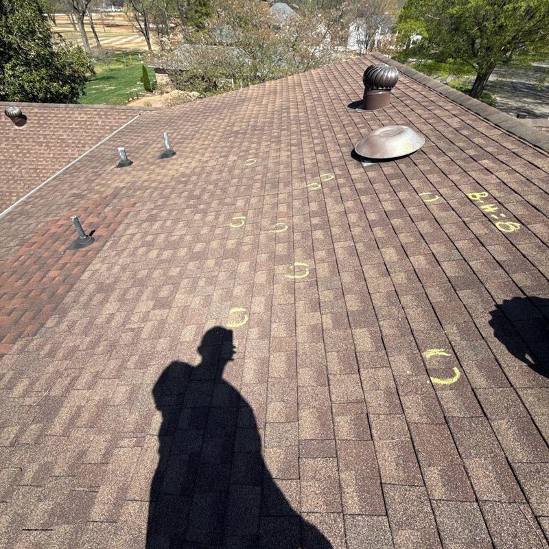 Asphalt shingle roof with hail damage markings