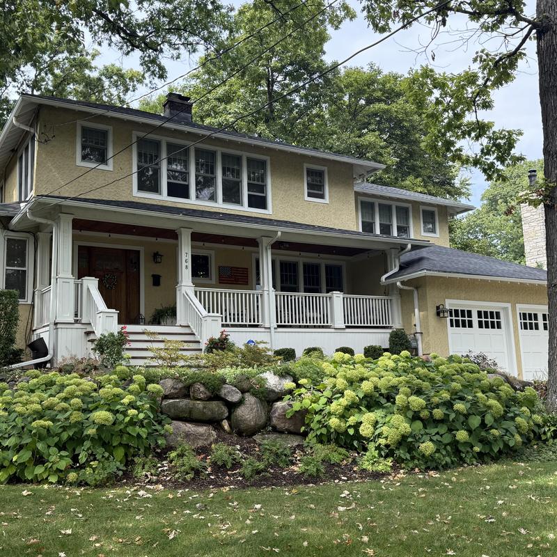 Atlas impact class 4 roof with gutter guards on house