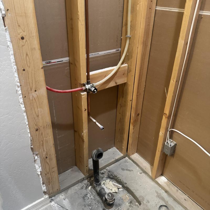Shower plumbing drain and valve rough-in framing