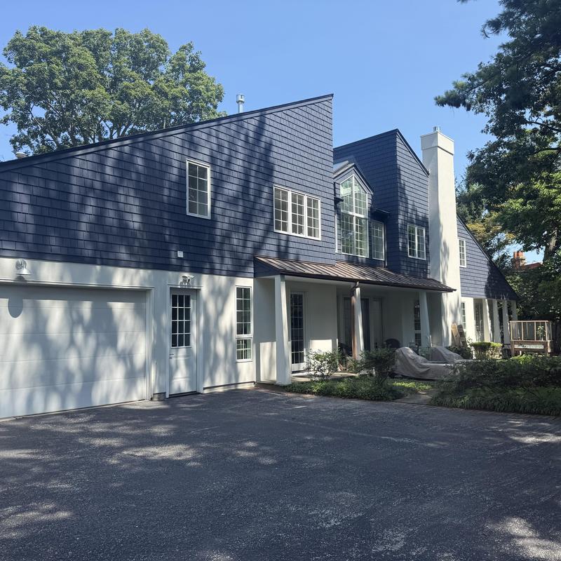 Gutters with gutter guards on residential house exterior