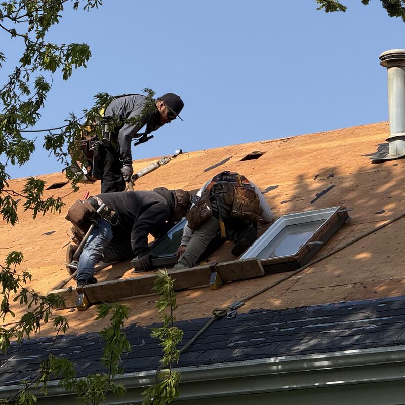 Roof window installation on wooden roof decking