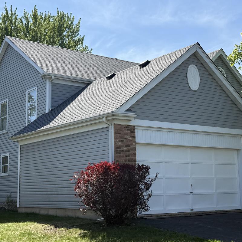 Atlas impact class 4 roof with gutter guards on house