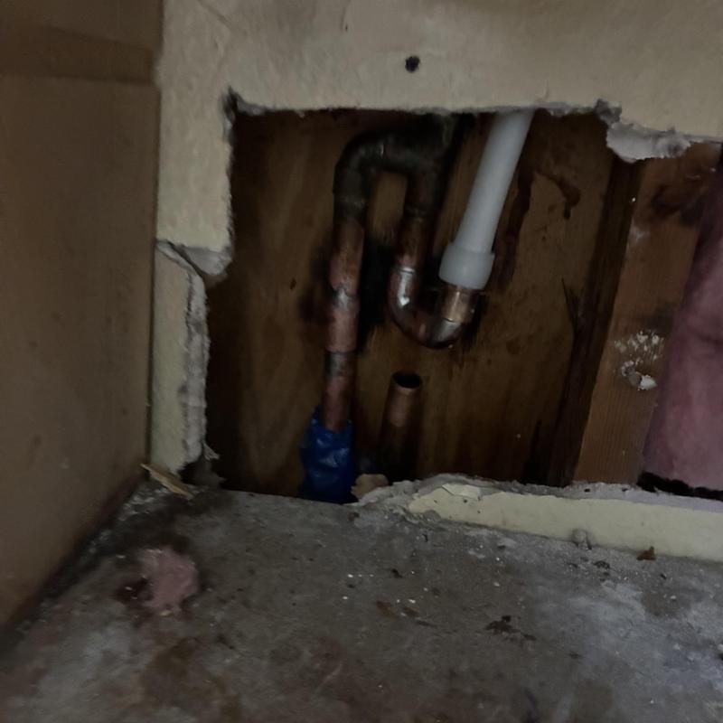 Cold water pipe reroute repair under slab in wall cavity