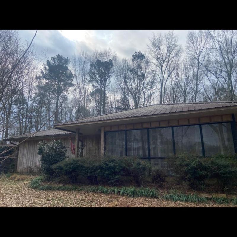 Metal roof system on residential home with trees