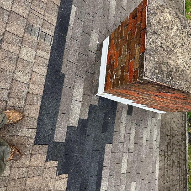 Roof shingle replacement and chimney flashing repair