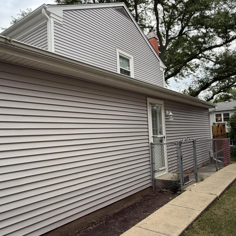 Vinyl siding and gutters on residential house exterior