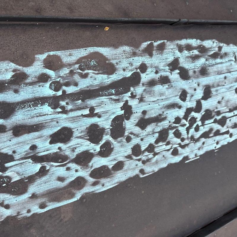 Asphalt shingle roof with hail damage marks