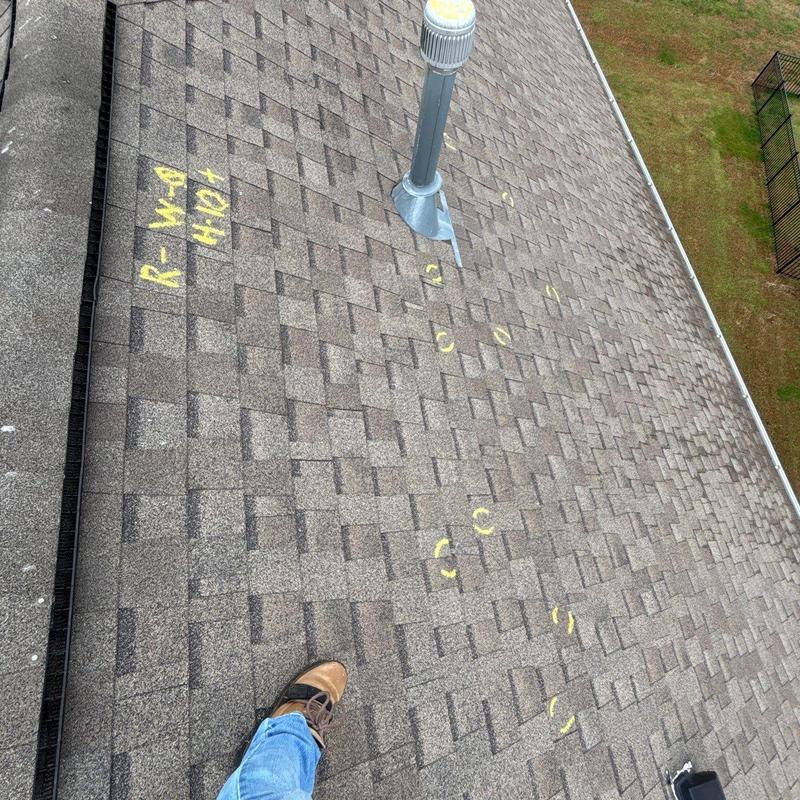 Asphalt shingle roof with hail damage markings