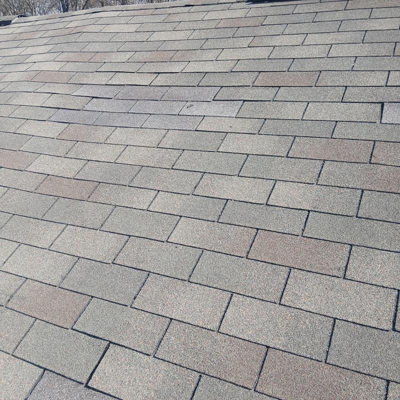 Asphalt shingles on residential roof after replacement