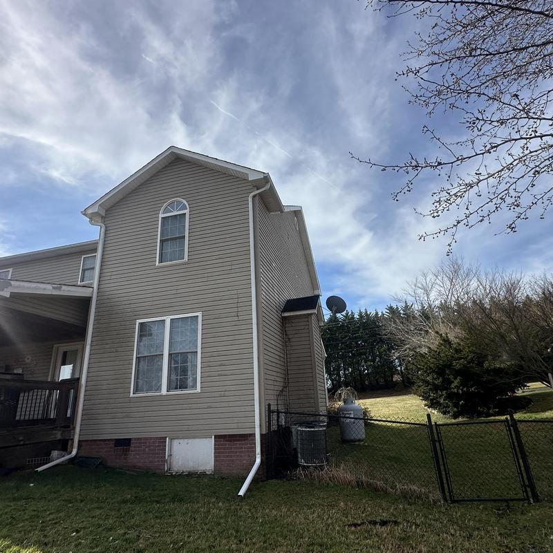 Residential roofing shingles replacement on house exterior