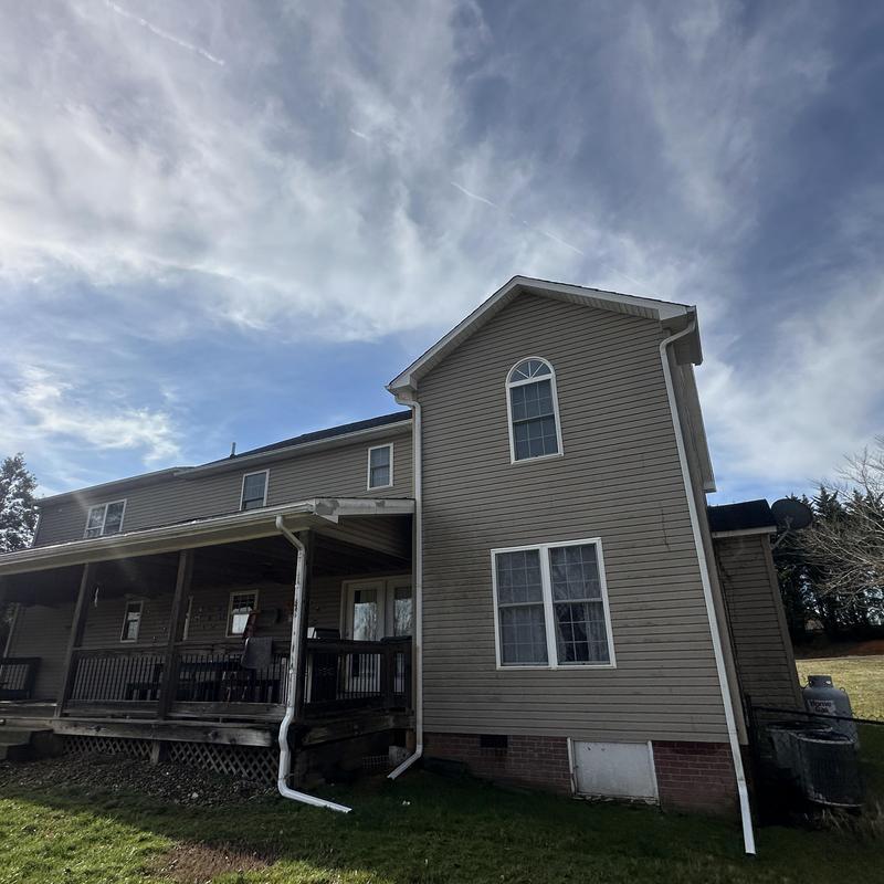 Shingle roof replacement on residential house exterior