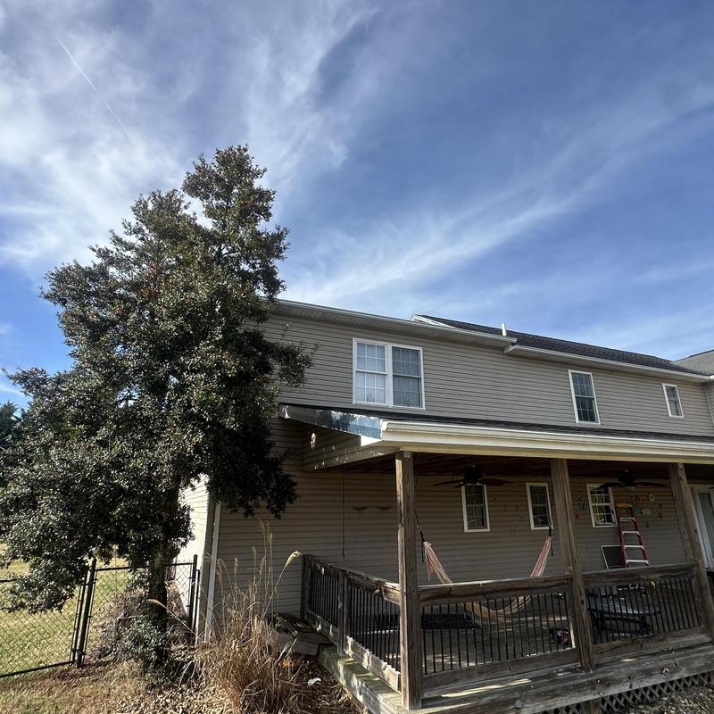 Roof shingles on residential house with covered porch