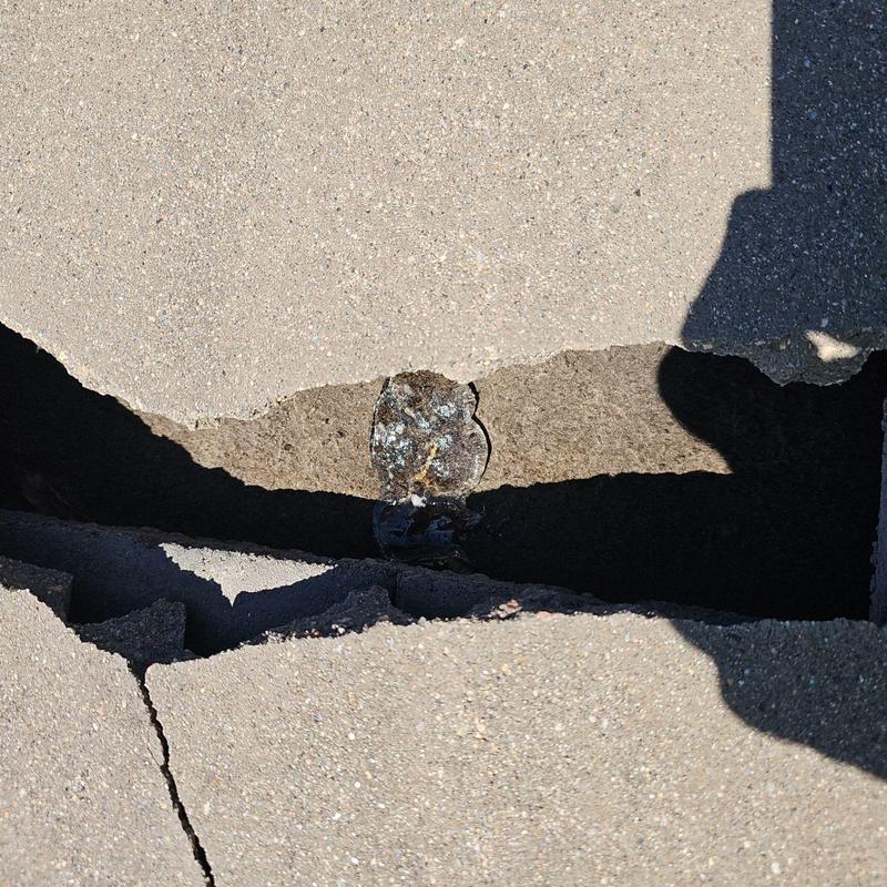 Tile roof broken tile with underlying damage visible Tile roof broken tile with underlying damage visible