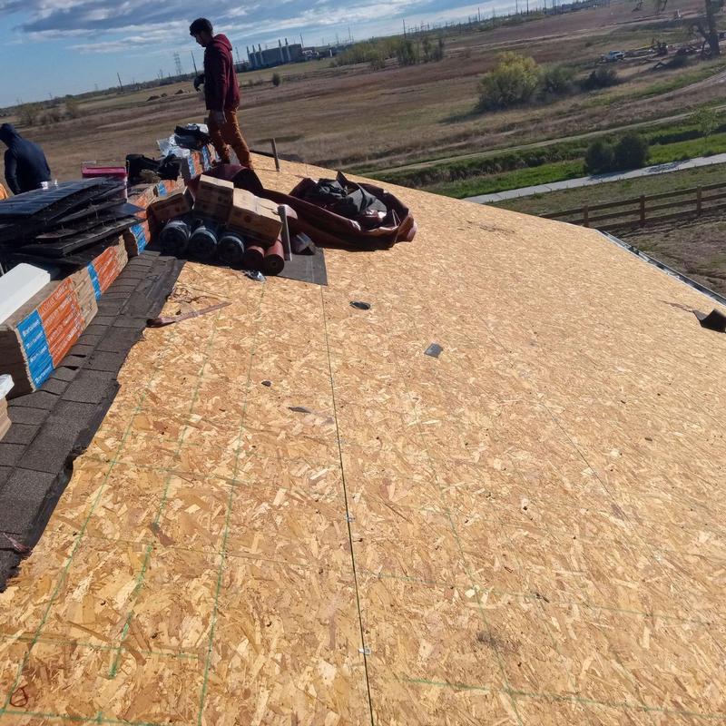 Roof decking installation with materials staged on top Roof decking installation with materials staged on top
