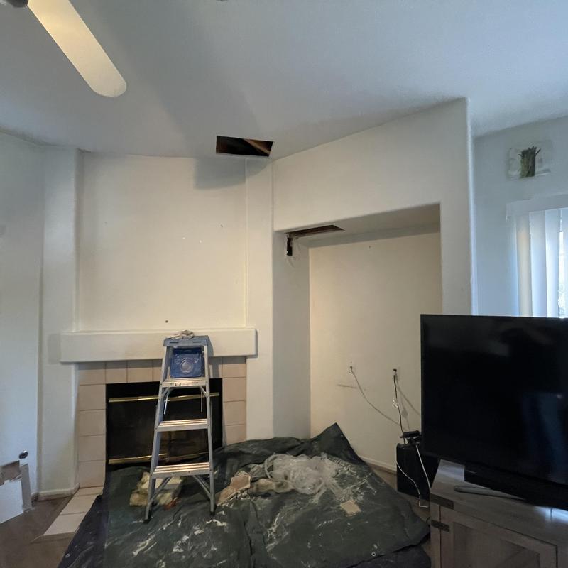 Drywall ceiling access with holes near fireplace