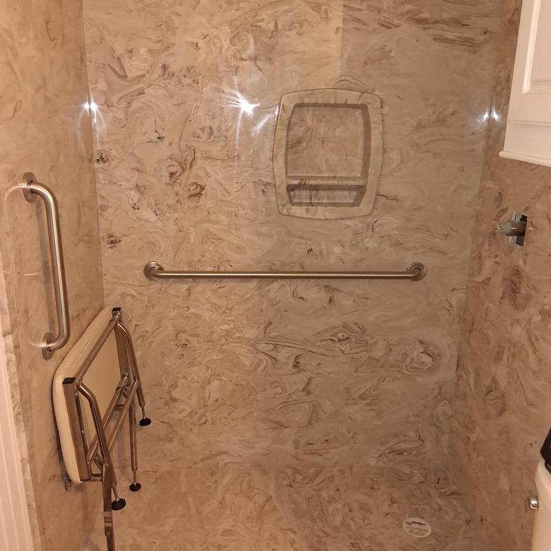 Groutless ADA shower with seats and grab bars