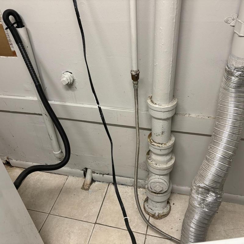Bathroom secondary drain line with plumbing pipes