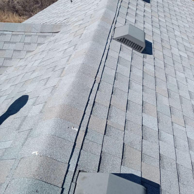 Asphalt shingle roof with ventilation caps, no damage Asphalt shingle roof with ventilation caps, no damage