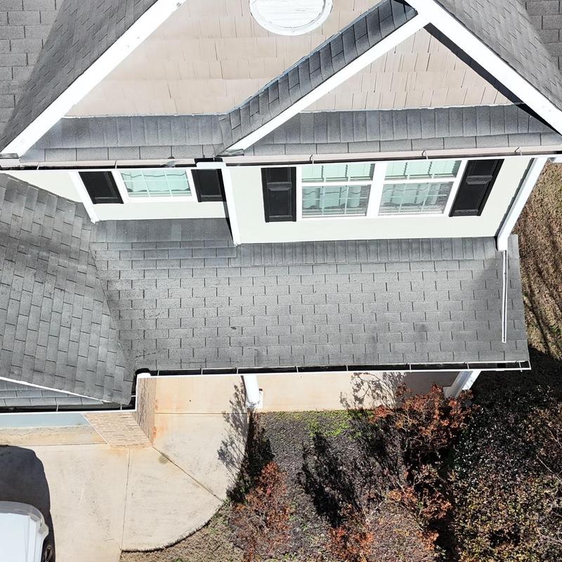 Asphalt shingle roof with multiple sections and valleys