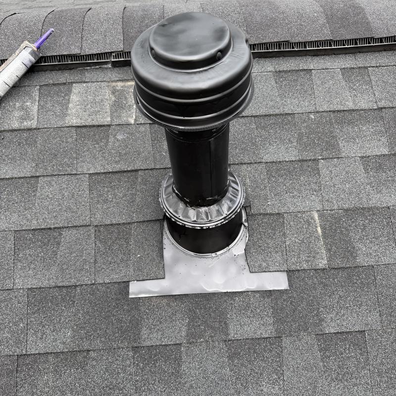 Roof vent flashing and new gray shingles installation