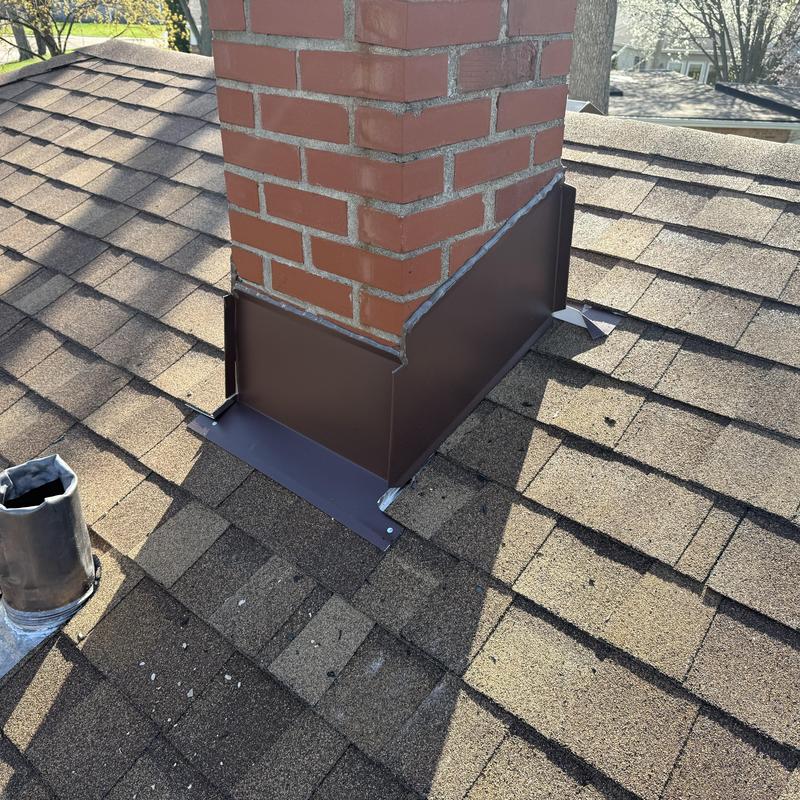 Chimney flashing on asphalt shingle roof