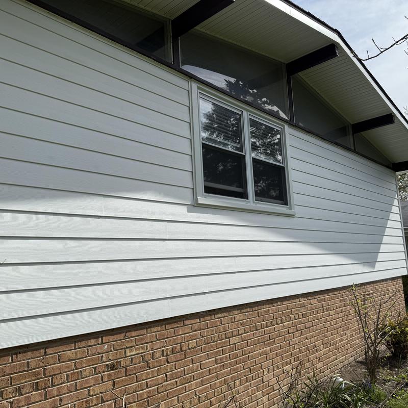 Composite insulated siding and double-pane windows exterior