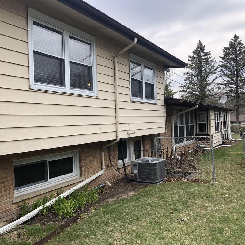 Composite insulated siding and windows on residential house
