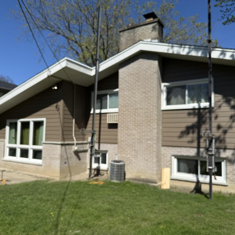 Composite insulated siding and soffit on house exterior