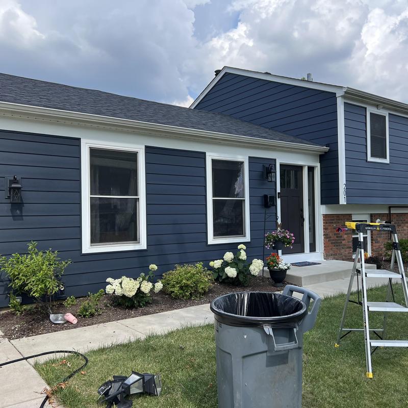 Composite insulated siding and entry door installation