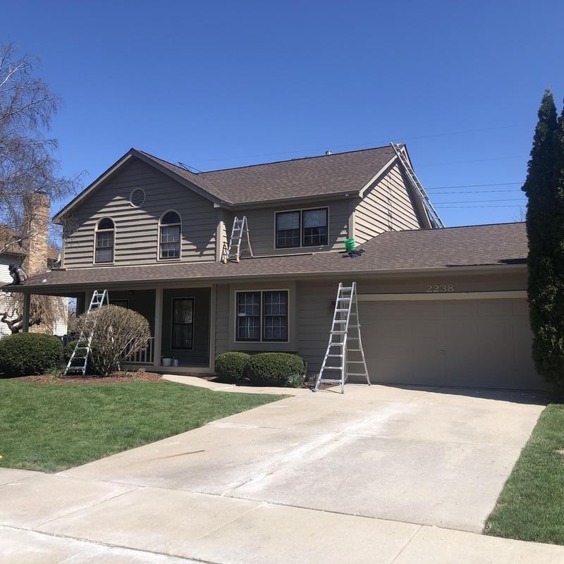 Atlas impact class 4 roof with ladders on two-story house