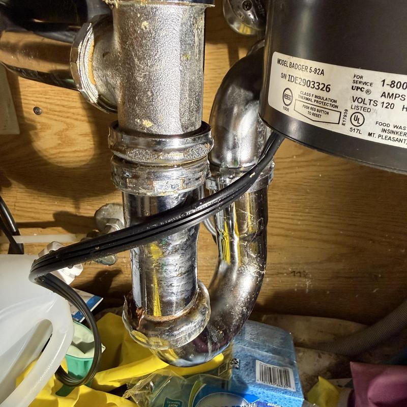 Garbage disposal and P-trap under kitchen sink installation