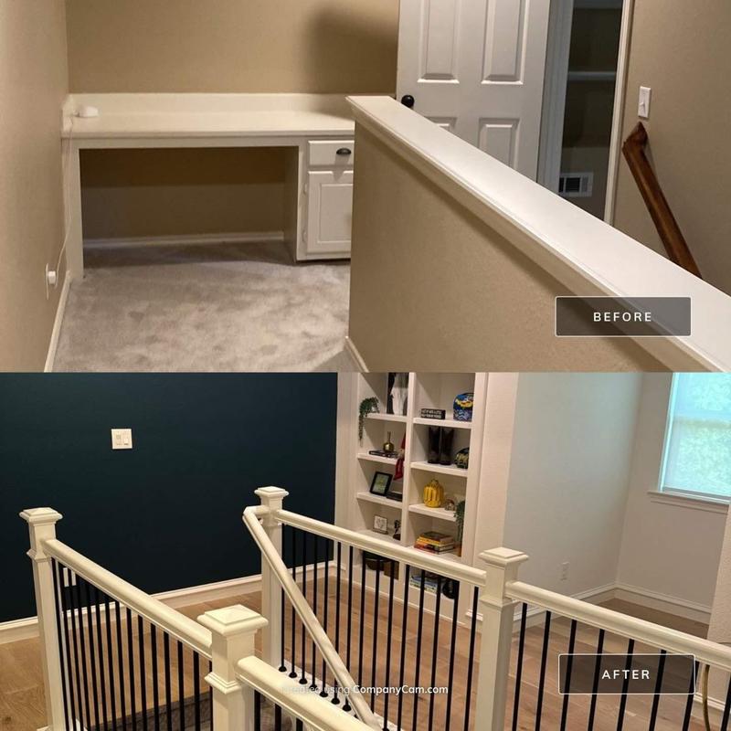 Upstairs stair railing with black balusters and wood posts Upstairs stair railing with black balusters and wood posts