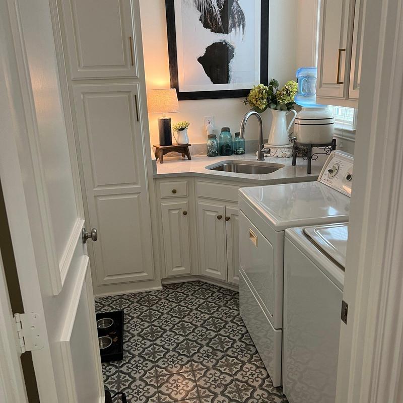 Quartz countertops and painted cabinets with stainless sink