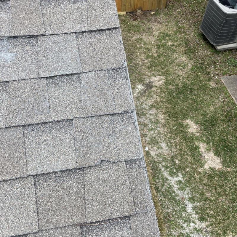 Architectural shingle damage along roof edge in Pearland, TX