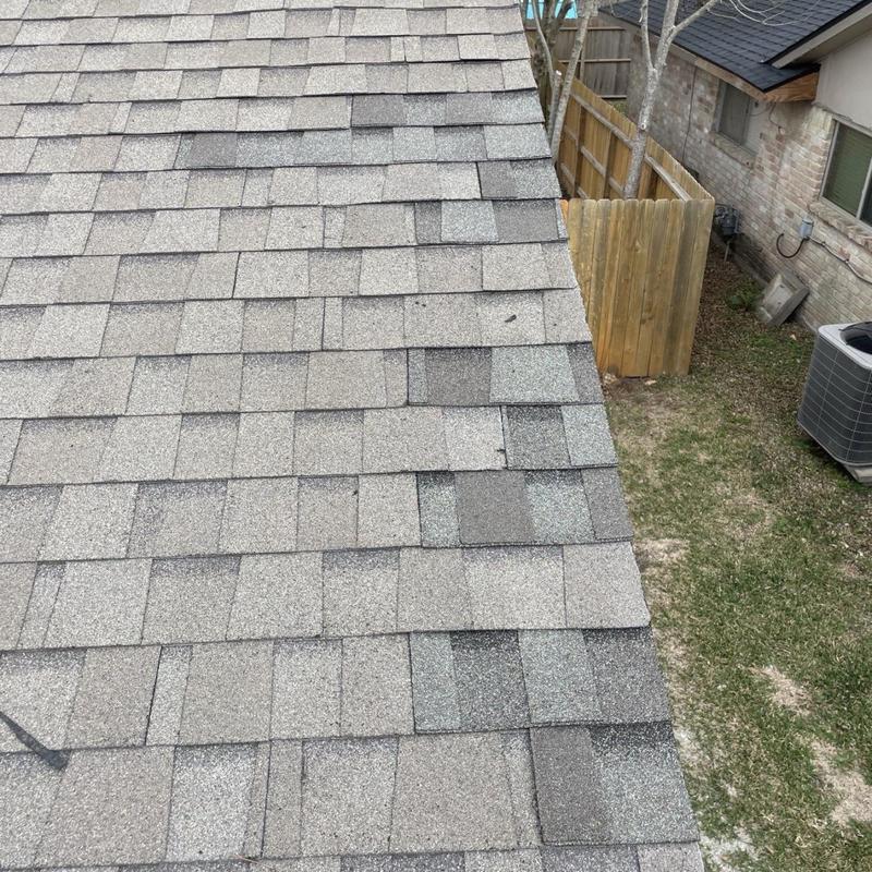Architectural asphalt shingles on residential roof slope