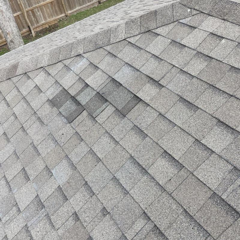 Architectural asphalt shingles on residential roof slope