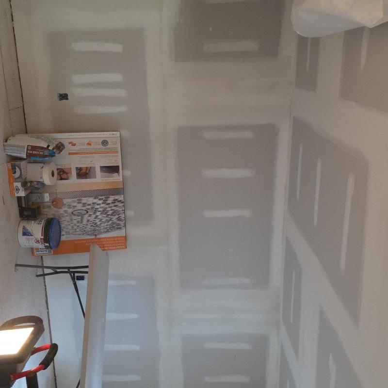 Drywall installation and finishing in interior room