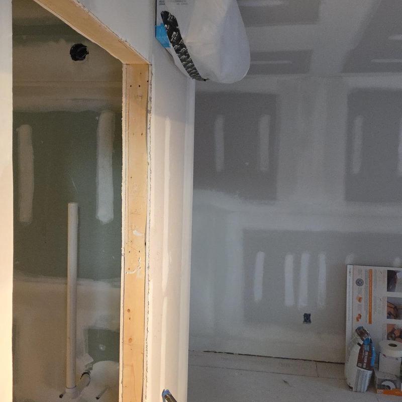 Drywall installation and finishing in bathroom renovation