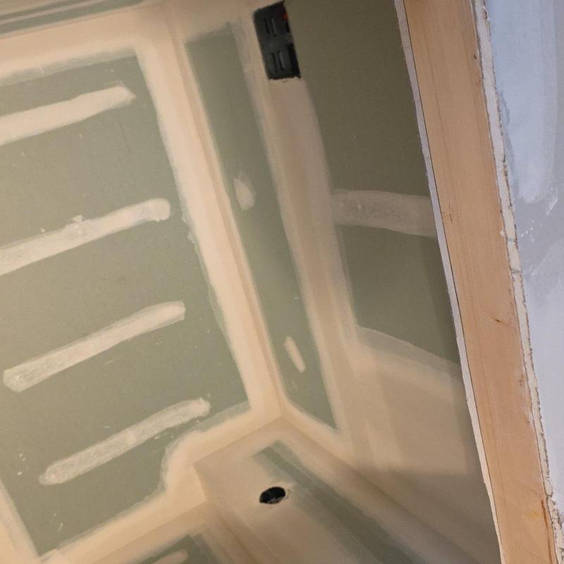 Green drywall installation and finishing in bathroom corner