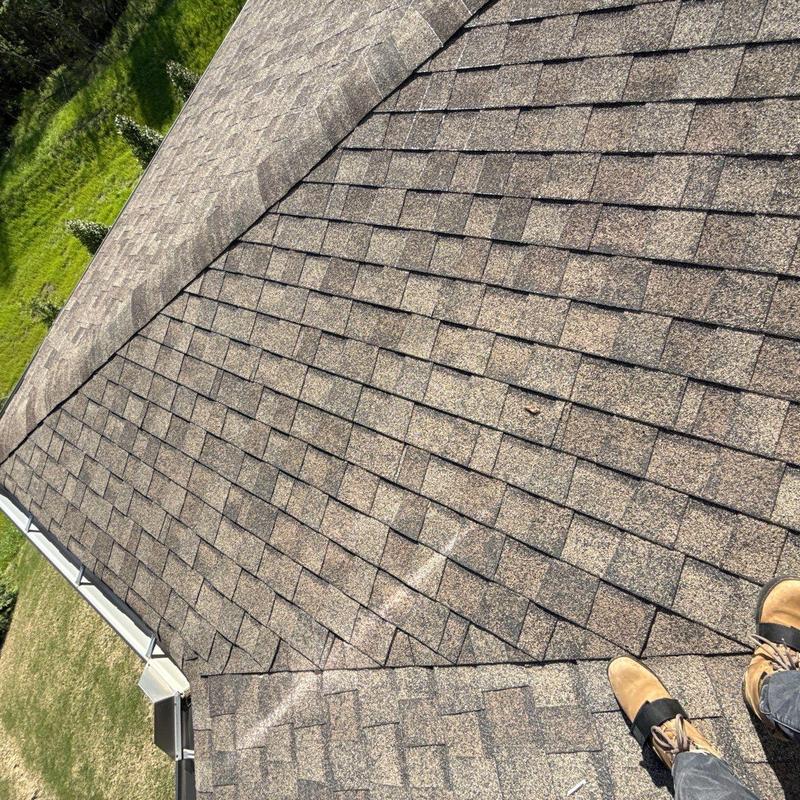 Asphalt shingle roof with visible hail damage
