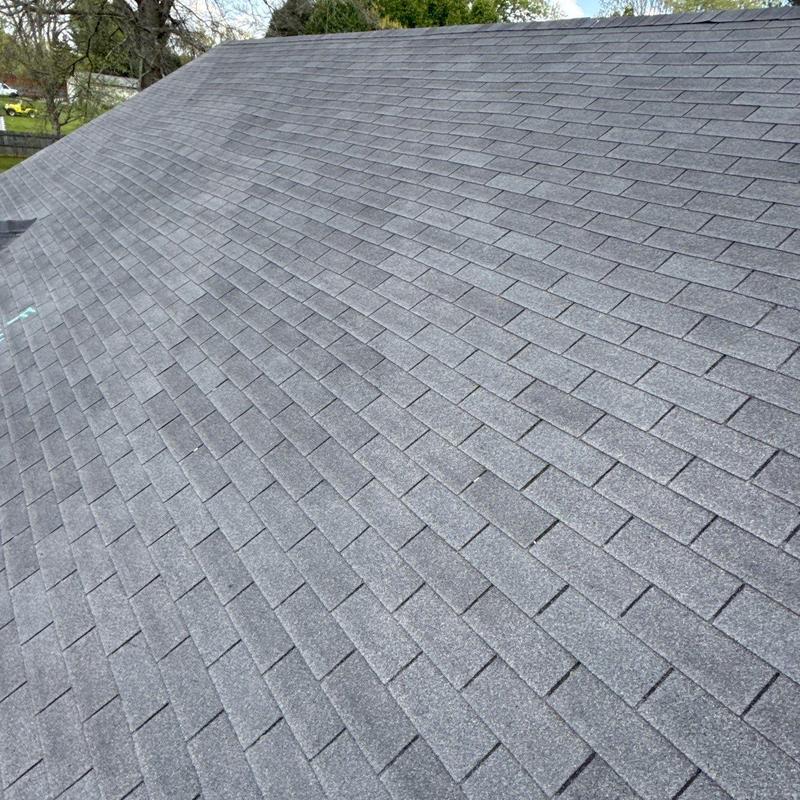 Asphalt shingle roof with hail damage inspection