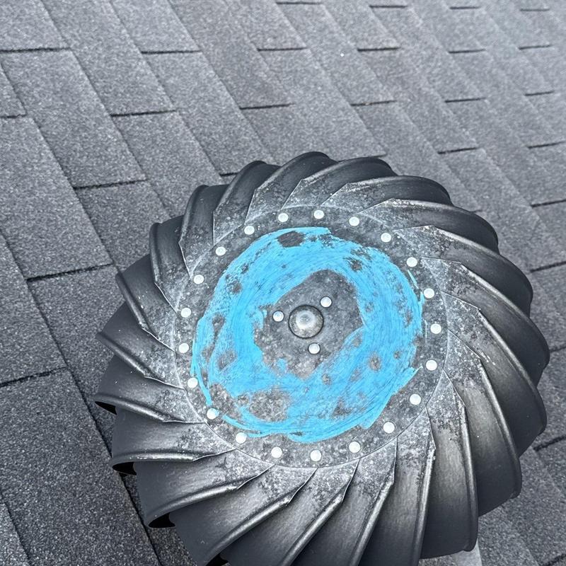 Roof turbine vent with corrosion on shingle roof