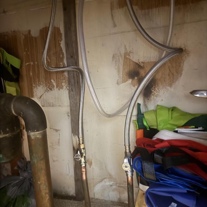 Flexible supply lines connected to plumbing valves Flexible supply lines connected to plumbing valves