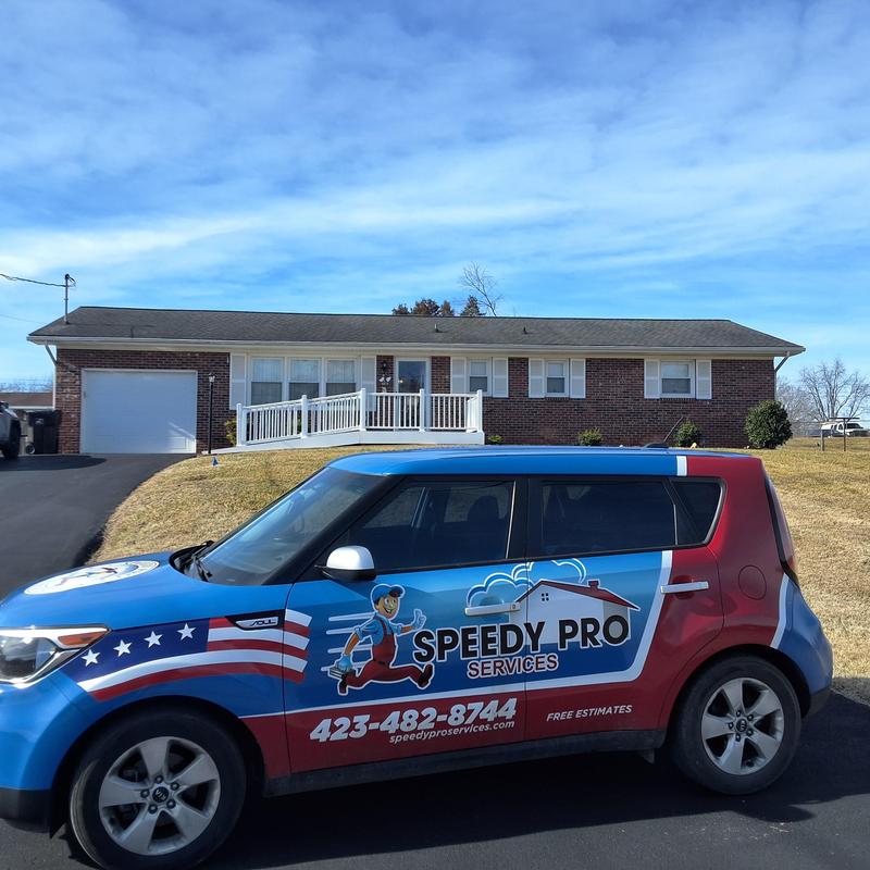 Roof shingles with wind and water damage indicators