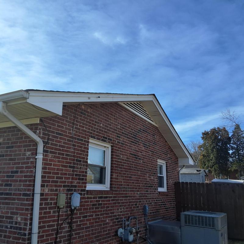 Roof shingles with wind damage and granule loss