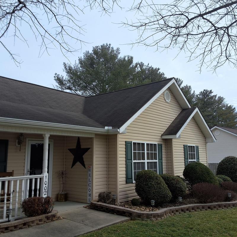 Asphalt shingle roof with hail and wind damage inspection